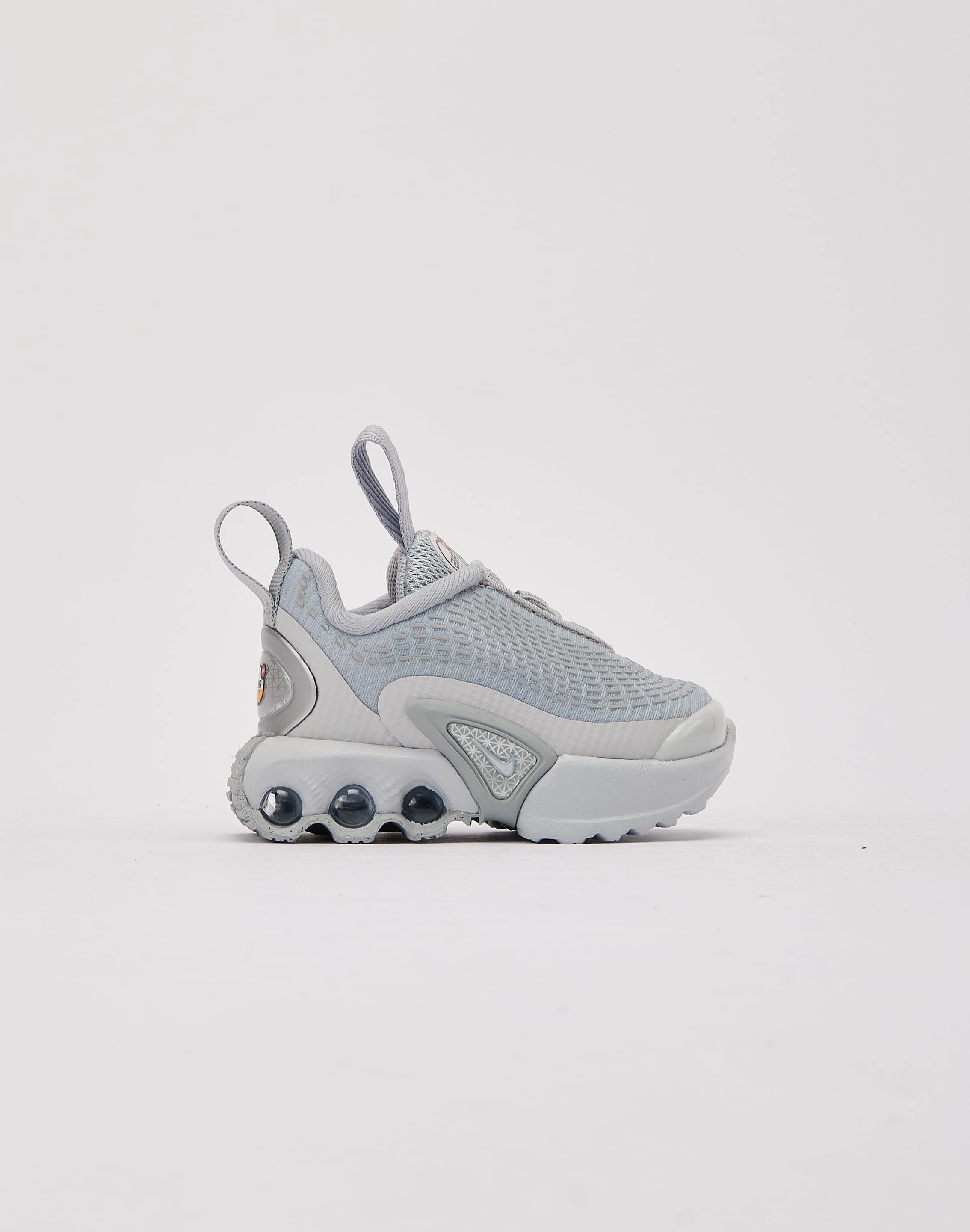 Nike Air Max Dn Toddler running in a forest shoes